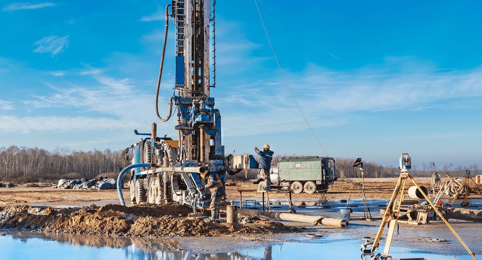 Field workers examining a core sample